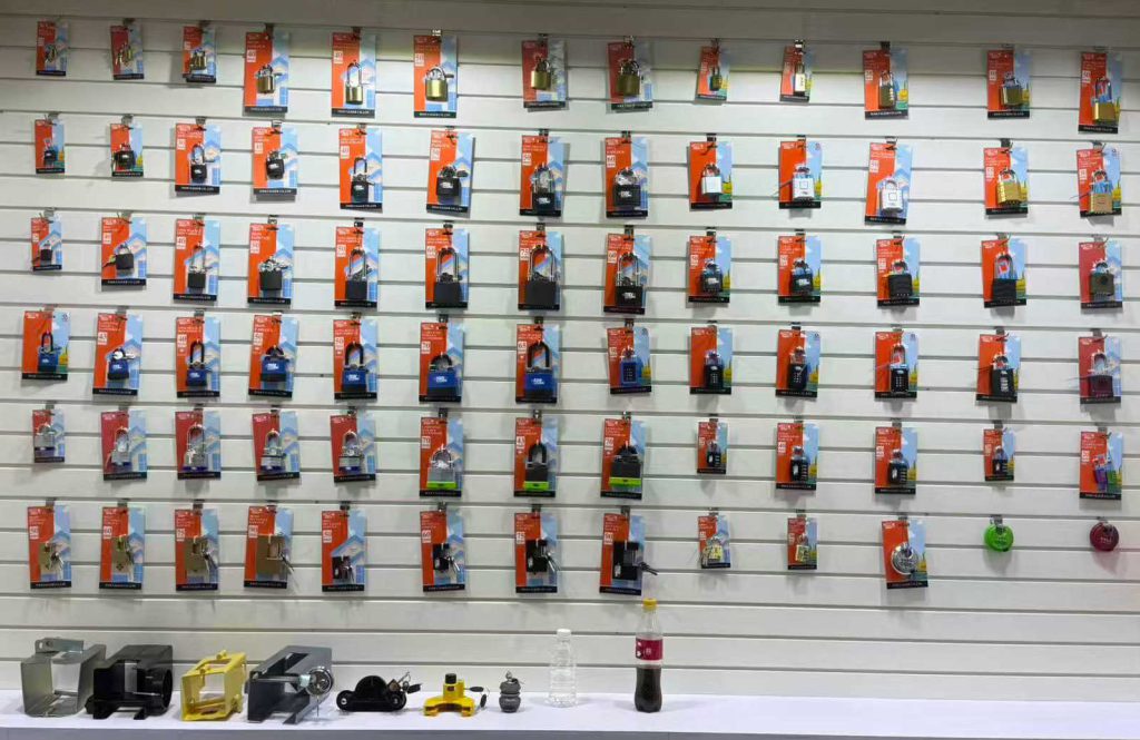 Wholesale security padlock factory showroom display, heavy-duty brass iron and laminated steel padlock blister card retail packaging wall factory supplier.