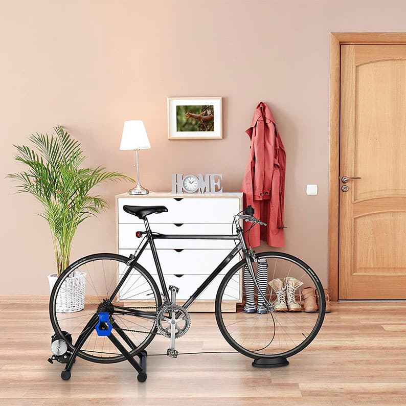 Wholesale indoor bicycle trainer stand lifestyle scene, heavy-duty foldable magnetic cycling training rack with front wheel riser block factory supplier.